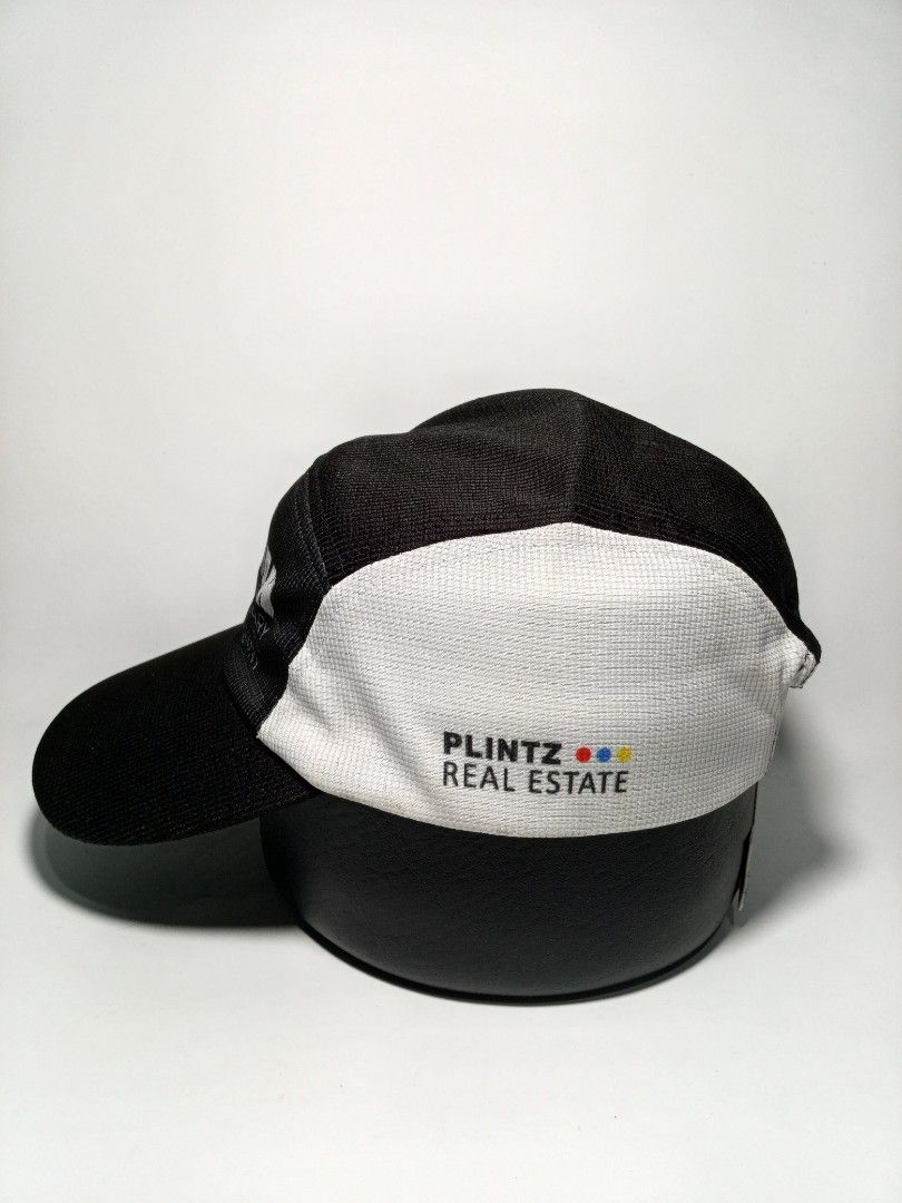 Ironman 70.3 Calgary Harmony Running Cap (Category: Caps & Hats) located in Lucena. Submitted by sanera_23 (Listing ID 1469348916, Image 3). Description: - Authentic Ironman 70.3 Calgary Harmony cap in black and white - Features a cool bull graphic on one side panel - Includes Plintz Real Estate branding on the other side - Adjustable white strap closure for a custom fit - Classic athletic design, great for training or casual wear - A must-have c