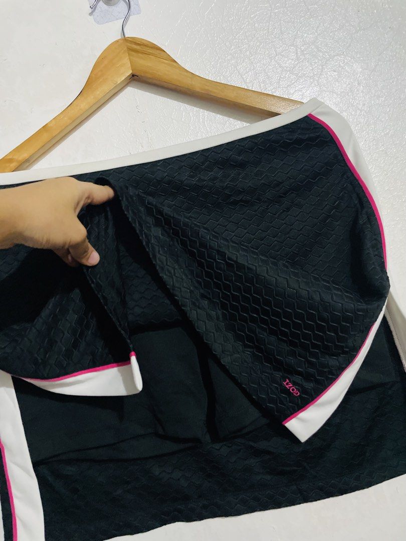 IZOD Cool FX Athletic Skort (Category: Skirts) located in Caloocan City. Submitted by lovemyclothes21 (Listing ID 1469266031, Image 2). Description: - Brand: IZOD - Size: Small - Color: Black with white and pink contrast details - Fabric: 100% polyester body with 92% polyester/8% spandex undershorts - Technology: Cool FX fabric for comfort - Features: Textured pattern and built-in undershorts for active movement - Condition: Clean and ready to we