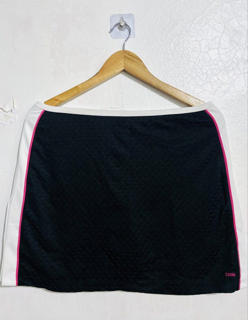 IZOD Cool FX Athletic Skort (Category: Skirts) located in Caloocan City. Submitted by lovemyclothes21 (Listing ID 1469266031, Image 1). Description: - Brand: IZOD - Size: Small - Color: Black with white and pink contrast details - Fabric: 100% polyester body with 92% polyester/8% spandex undershorts - Technology: Cool FX fabric for comfort - Features: Textured pattern and built-in undershorts for active movement - Condition: Clean and ready to we