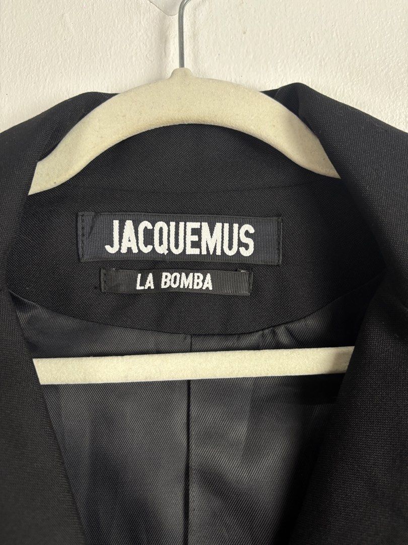 Jacquemus La Bomba Wool Blazer Black Size M (Category: Coats, Jackets and Outerwear) located in Dasmarinas. Submitted by goldengem_e4eb01 (Listing ID 1469169848, Image 3). Description: JAC.QUEMUS LA BOMBA COLLECTION.RUNWAY PIECE.AUTHENTIC BLACK LE SOUK WOOL BLAZER JACKET.TAILORED WRAP FRONT SINGLE BUTTON CLOSURE.WITH DRAMATIC RUCHED PEPLUM HEM.SIZE M ON TAG.RETAIL FOR 39K-56K SHOULDER - 15 TO 16 ARM HOLE - 18 DIAMETER ARM LENGTH - 22 BUST - 36 WA