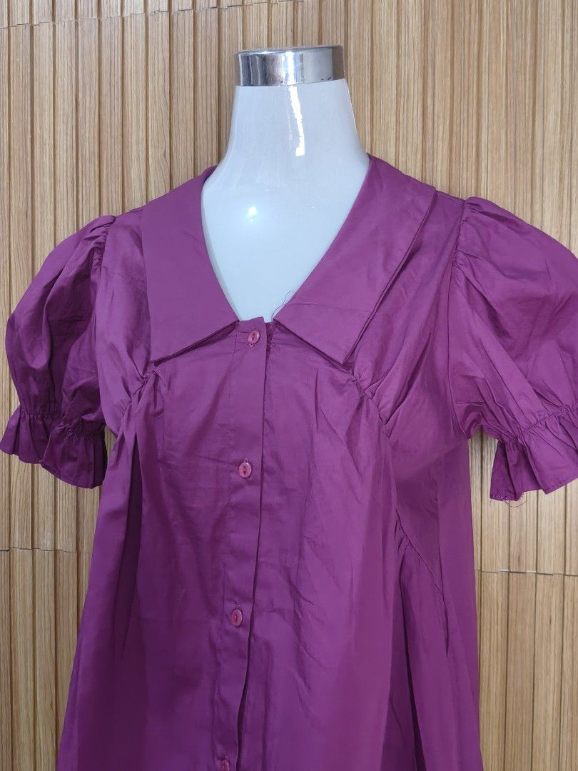 JamBee Purple Puffed Sleeve Button Dress (Category: Dresses) located in Taguig. Submitted by ashie_clothing (Listing ID 1469204973, Image 2). Description: - Brand: JamBee - Style: Korean design, mini length flare cut - Details: Short puffed sleeves with ruffled cuffs, classic collar, front button closure, and gathered pleat bodice - Condition: Brand new with original brand tag still attached - Color: Purple.