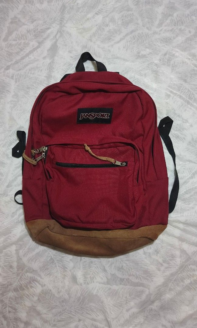 JANSPORT BACKPACK (Category: Backpacks) located in Manila. Submitted by reytambuco24 (Listing ID 1469278811, Image 2). Description: Original Jansport brand Spacious main compartment Front zip pocket Adjustable shoulder straps Sturdy top handle Suede-like bottom panel SIZE (Approx.) Height: ~18–20 in (46–51 cm) Width: ~12–14 in (30–36 cm) Depth: ~5–7 in (13–18 cm) CONDITION Pre-owned, in good condition. Some signs of use (normal wear on the bottom