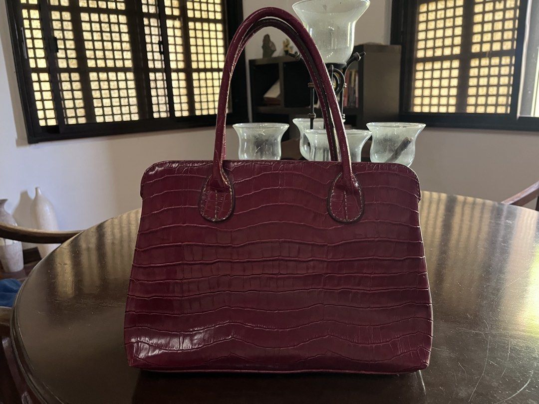 Japan Bought Red Crocodile Leather Bag (Category: Purses & Pouches) located in Manila. Submitted by basilgrass (Listing ID 1469184811, Image 1). Description: - Good condition, slightly used. - No damage, just needs cleaning. - Can fit a 10.9 apple ipad. - Brand unknown, thrifted from Japan. Size: (Also indicated in photo) Width: 13in Height: 9.5in RFS: Too many bags, dust collector nalang sa cabinet kasi hindi kasya laptop ko. MOP: BPI/GCASH MOD: