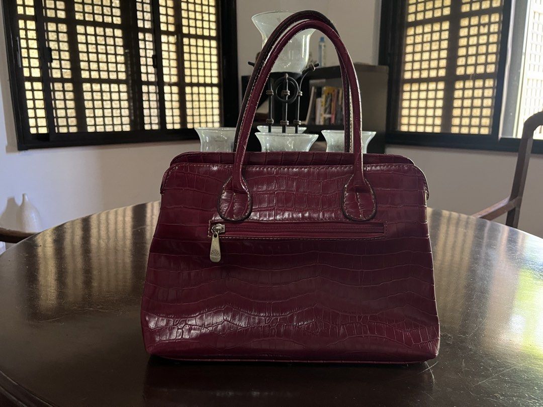 Japan Bought Red Crocodile Leather Bag (Category: Purses & Pouches) located in Manila. Submitted by basilgrass (Listing ID 1469184811, Image 3). Description: - Good condition, slightly used. - No damage, just needs cleaning. - Can fit a 10.9 apple ipad. - Brand unknown, thrifted from Japan. Size: (Also indicated in photo) Width: 13in Height: 9.5in RFS: Too many bags, dust collector nalang sa cabinet kasi hindi kasya laptop ko. MOP: BPI/GCASH MOD: