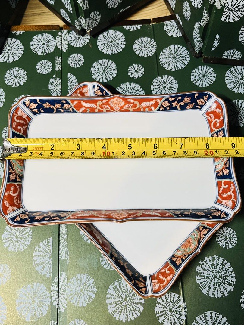 Japanese Ceramic Rectangular Serving Plates Set of 2 (Category: Dinnerware & Cutlery) located in Malabon City. Submitted by mgsurplus (Listing ID 1469192995, Image 2). Description: - Set of 2 rectangular ceramic trays with a traditional Japanese aesthetic - Features vibrant blue and orange floral borders and delicate side branch paintings - Dimensions: Roughly 8.5 inches by 5.5 inches each - Space-saving stackable design for easy cupboard storage