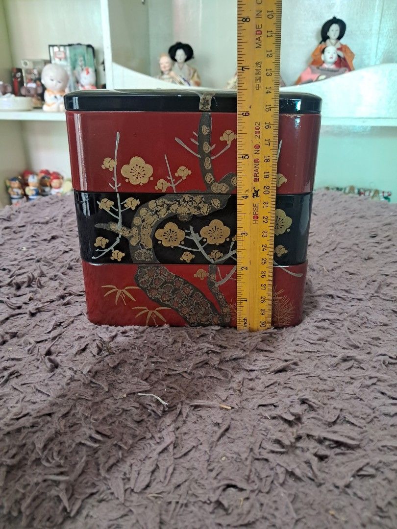 Japanese Lacquerware 3-Layer Display Box (Category: Storage Boxes & Baskets) located in Cavite. Submitted by secretjapansurplus (Listing ID 1469205859, Image 1). Description: Features a stunning black and red lacquer finish with elegant gold floral branch detailing. Perfect as a decorative centerpiece, jewelry/trinket organizer, or a beautiful addition to your home aesthetic. 📌 Product Details: • Dimensions: Approximately 6 inches x 6 inches (Le