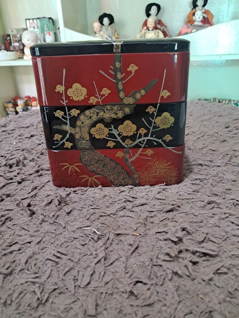 Japanese Lacquerware 3-Layer Display Box (Category: Storage Boxes & Baskets) located in Cavite. Submitted by secretjapansurplus (Listing ID 1469205859, Image 2). Description: Features a stunning black and red lacquer finish with elegant gold floral branch detailing. Perfect as a decorative centerpiece, jewelry/trinket organizer, or a beautiful addition to your home aesthetic. 📌 Product Details: • Dimensions: Approximately 6 inches x 6 inches (Le