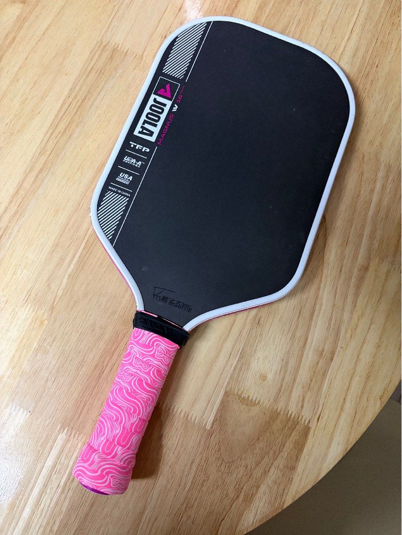 Joola Magnus Pro 4 pickleball paddle (Category: Racket and Ball Sports) located in Paranaque City. Submitted by twofoursevenmom (Listing ID 1469308449, Image 2). Description: 16mm elongated, short handle Bought last August 2026 at Juego ATC Used for less than 2 months *has some scruffs on the top part but does not affect performance Newly installed grip tape and Joola Britto edge guard RFS: want to try other paddles.