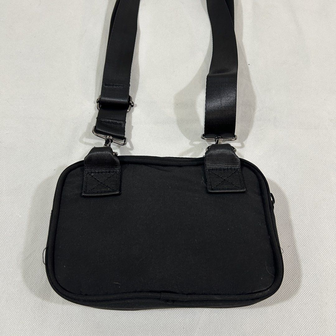 Jordan Flight Black Crossbody Bag (Category: Sling Bags) located in Cavite. Submitted by moo2k (Listing ID 1469204067, Image 3). Description: - Brand: Jordan Flight - Color: Classic black with white Flight patch - Material: Durable fabric construction - Compartments: Main zip compartment, smaller front pocket, and interior zippered pocket - Details: Woven Jordan logo patch inside - Strap: Adjustable shoulder strap with sturdy metal clips - Condit
