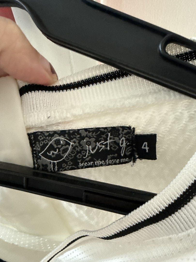 Just G White Quilted Romper Size 4 (Category: Rompers) located in Mandaluyong City. Submitted by declutteringmylife101 (Listing ID 1469169993, Image 2). Description: - Brand: Just G - Size: 4 -Romper style - Color: White with black striped trim - Material/Pattern: Textured quilted pattern across the body - Closure: Exposed silver zipper at the back - Features: Built-in side pockets and stylish crossover front hem - Condition: Excellent pre-loved 