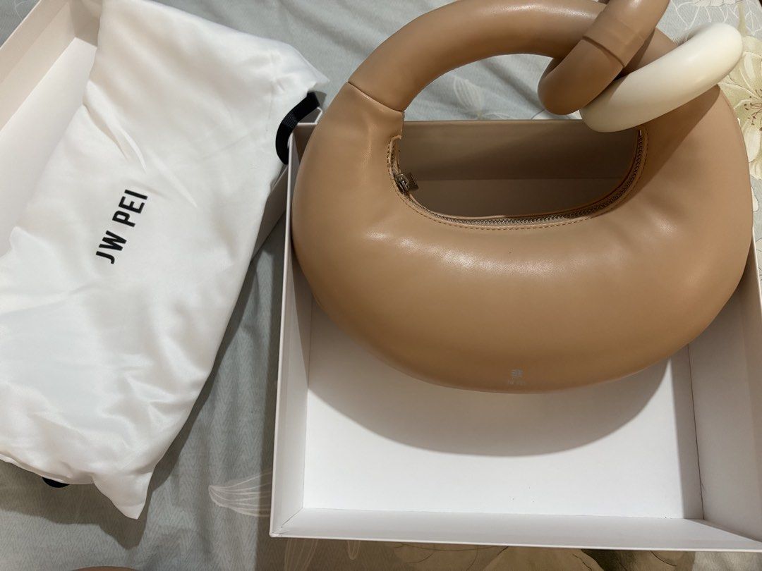 JW PEI Abacus Top Handle Bag (Category: Shoulder Bags) located in Makati City. Submitted by amarthas.closet (Listing ID 1469217616, Image 2). Description: - Color: Beige - Material: Vegan leather - Condition: Shows some wear and peeling near the zipper pull and along the seam. All flaws are shown in the pics. - Inclusions: Original box and white dust bag included .