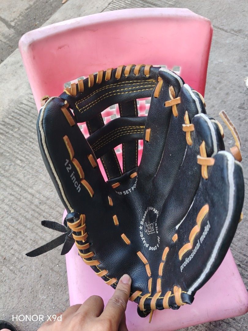 Kaiser 12 Inch Baseball Glove (Category: Racket and Ball Sports) located in Manila. Submitted by mightypenguin_44c1b5 (Listing ID 1469213441, Image 3). Description: - Brand: Kaiser - Size: 12 inches - Color: Black with contrasting tan lacing and yellow stitching - Design: Professional model with a deep set pocket for secure catches - Comfort: Features a soft palm lining for added comfort - Best for: Practice sessions and casual games - Condition: