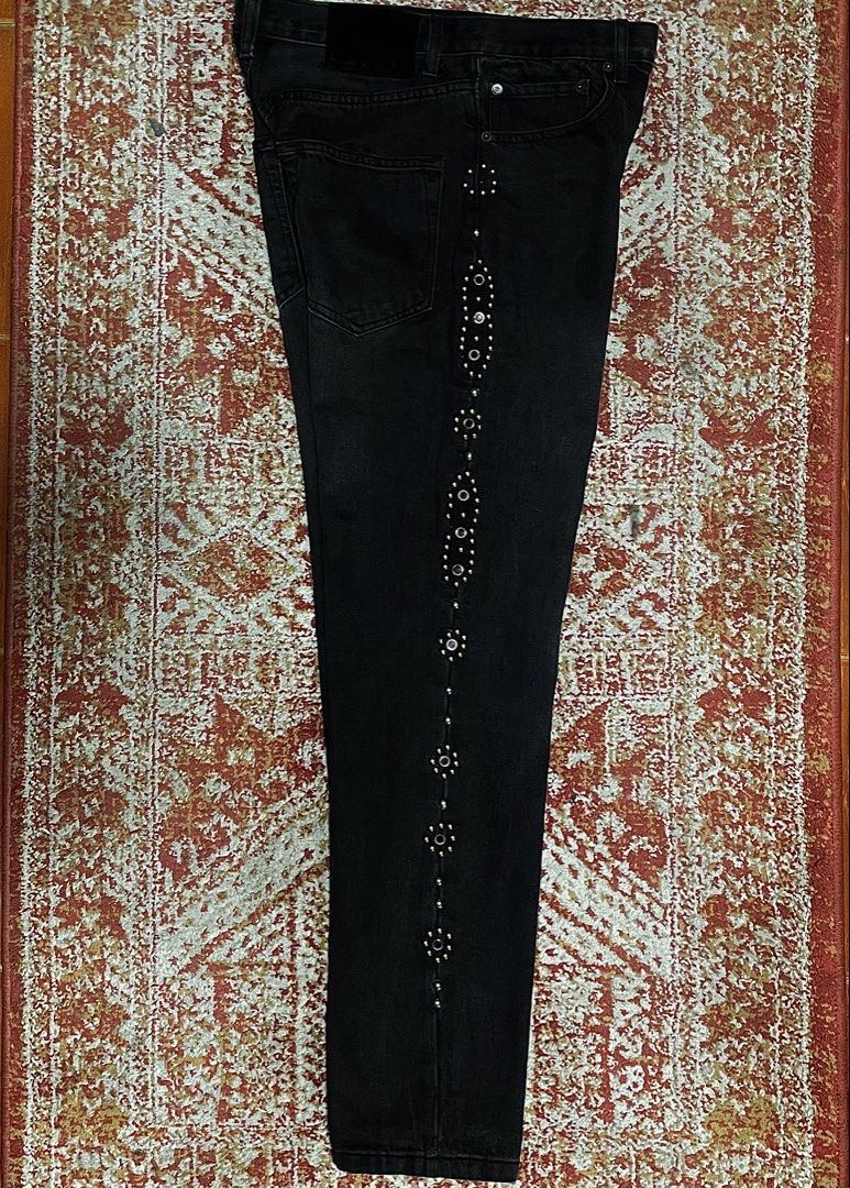 Kapital Black Studded Denim Jeans (Category: Jeans) located in Dumaguete. Submitted by raspberrypepsi (Listing ID 1469191312, Image 3). Description: Length: 41.5" Waist: 16.5" Width: 9" Hem: 7.5" - Brand: Black Kapital (Made in Japan) - Style: Straight leg cut with button fly and traditional five-pocket design - Details: Intricate silver stud patterns running down the outer seams of both legs - Material: Heavyweight solid cotton denim - Branding: