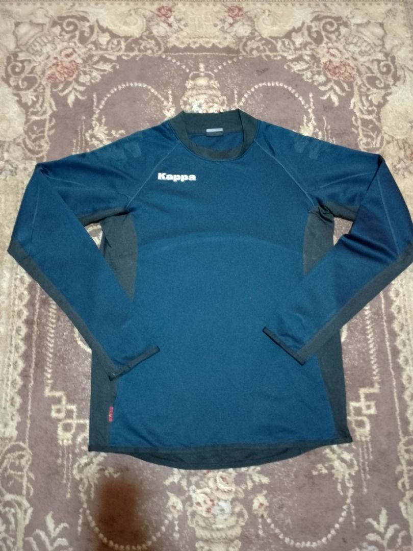 Kappa Blue Long Sleeve Athletic Track Jersey (Category: Longsleeves) located in Bayombong. Submitted by daily10 (Listing ID 1469192875, Image 1). Description: - Brand: Kappa - Size: M-L - Dimensions: 20" x 27f" x 28b" - Faded prints - Color: Blue and black with white logo and red brand tag - Style: Long sleeve sports top with ribbed crew neck, dark side panels, and sleeve cuffs - Material: Soft athletic fabric inside for extra comfort - Best for: