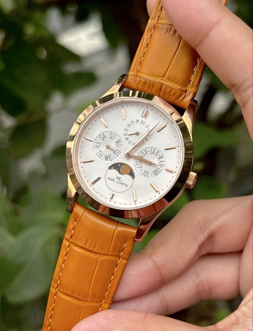 Karl Leimon Classic Pioneer Moonphase (Category: Men's Watches) located in Bulacan. Submitted by whatsonyourwristmnl (Listing ID 1469224237, Image 2). Description: KARL-LEIMON CLASSIC PIONEER MOONPHASE ✨ Elegant Japanese quartz watch with rose-gold-tone case, white dial, and moonphase complication. • Case size: Approx. 38mm • Movement: Japanese quartz • Functions: Day, date, month & moonphase • Crystal: Sapphire • Strap: Newly replaced leather st