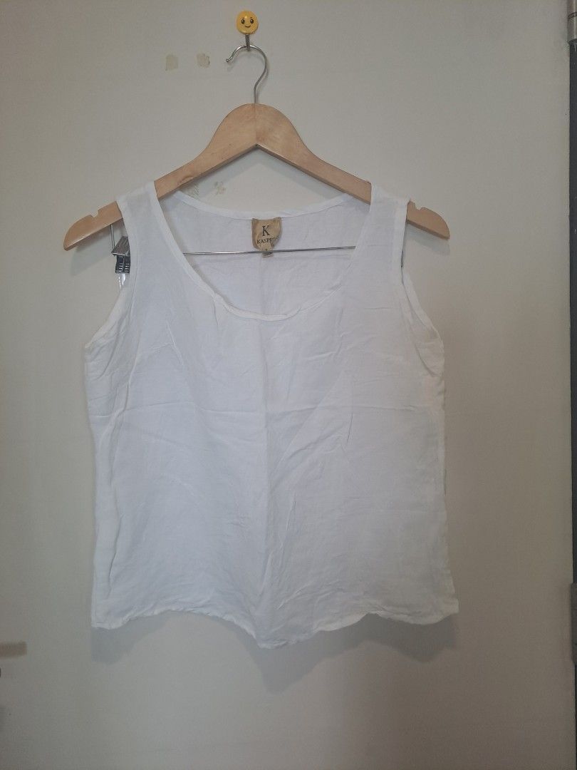 Kasper 100 % linen (Category: Sleeveless) located in Manila. Submitted by joanbalde39643 (Listing ID 1469204478, Image 1). Description: The item shown is a white linen sleeveless scoop-neck tank top, featuring wide shoulder straps and a relaxed, breezy silhouette. Based on the interior label, the brand is Kaspe (or Kasper), a label known for lightweight, breathable natural-fiber basics perfect for layering or warm weather.