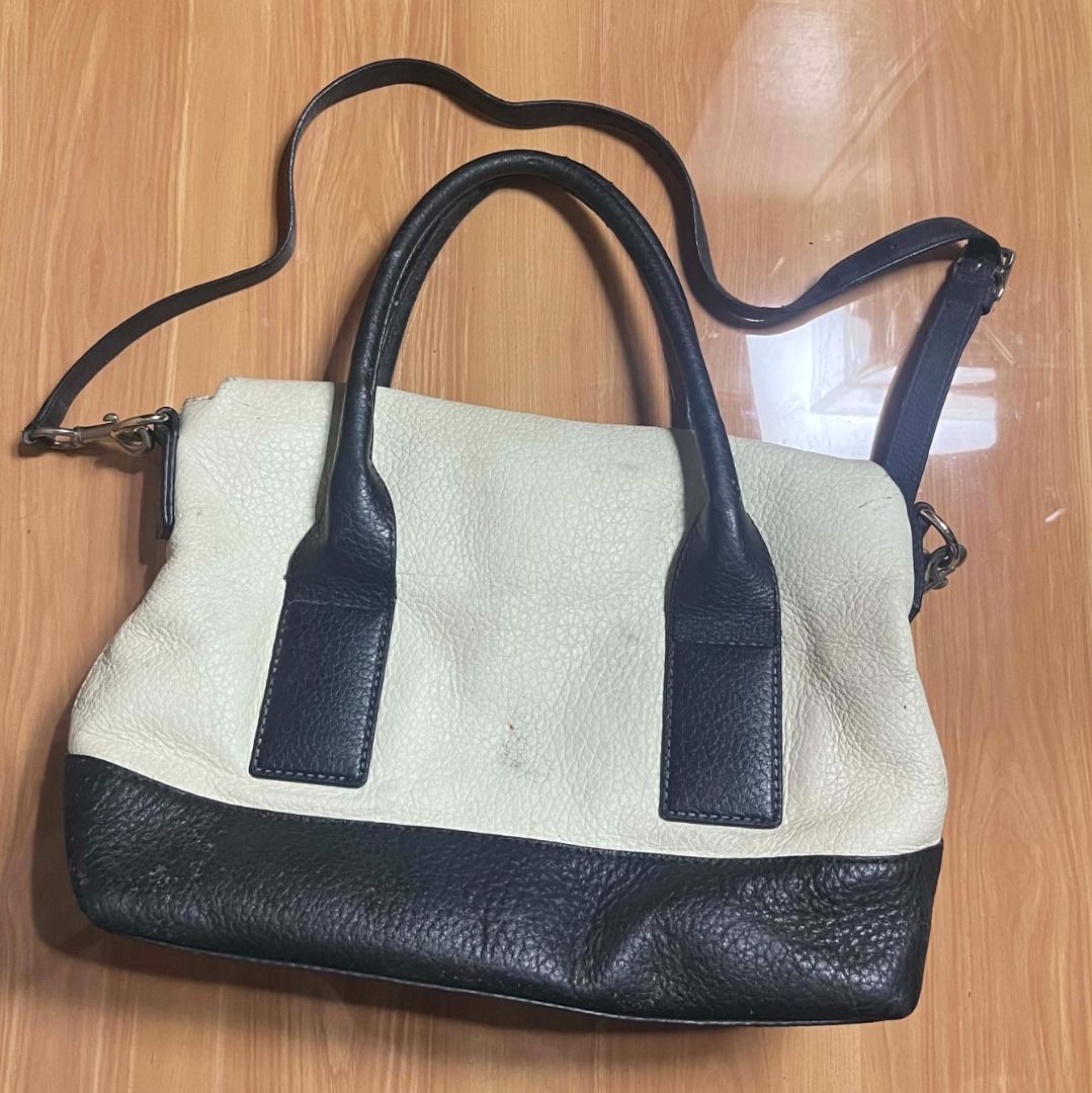 Kate Spade Black and White Leather Handbag (Category: Shoulder Bags) located in Manila. Submitted by senggggg. (Listing ID 1469190317, Image 3). Description: good condition working zip sign of use check details and size.