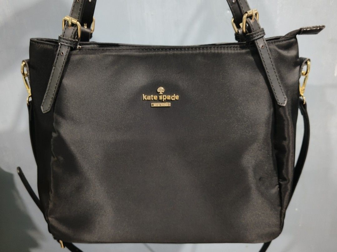 Kate Spade Black Nylon Shoulder Bag (Category: Luxury Bags & Wallets) located in Manila. Submitted by _cee02 (Listing ID 1469250578, Image 1). Description: - Brand: Kate Spade New York - Color/Material: Black nylon with gold-tone hardware - Closure: Secure top zipper - Features: Sturdy black shoulder straps, clean everyday silhouette - Interior: Includes style number tag (KATE28S121PA001) - Origin: Made in Vietnam - Condition: Excellent daily wea