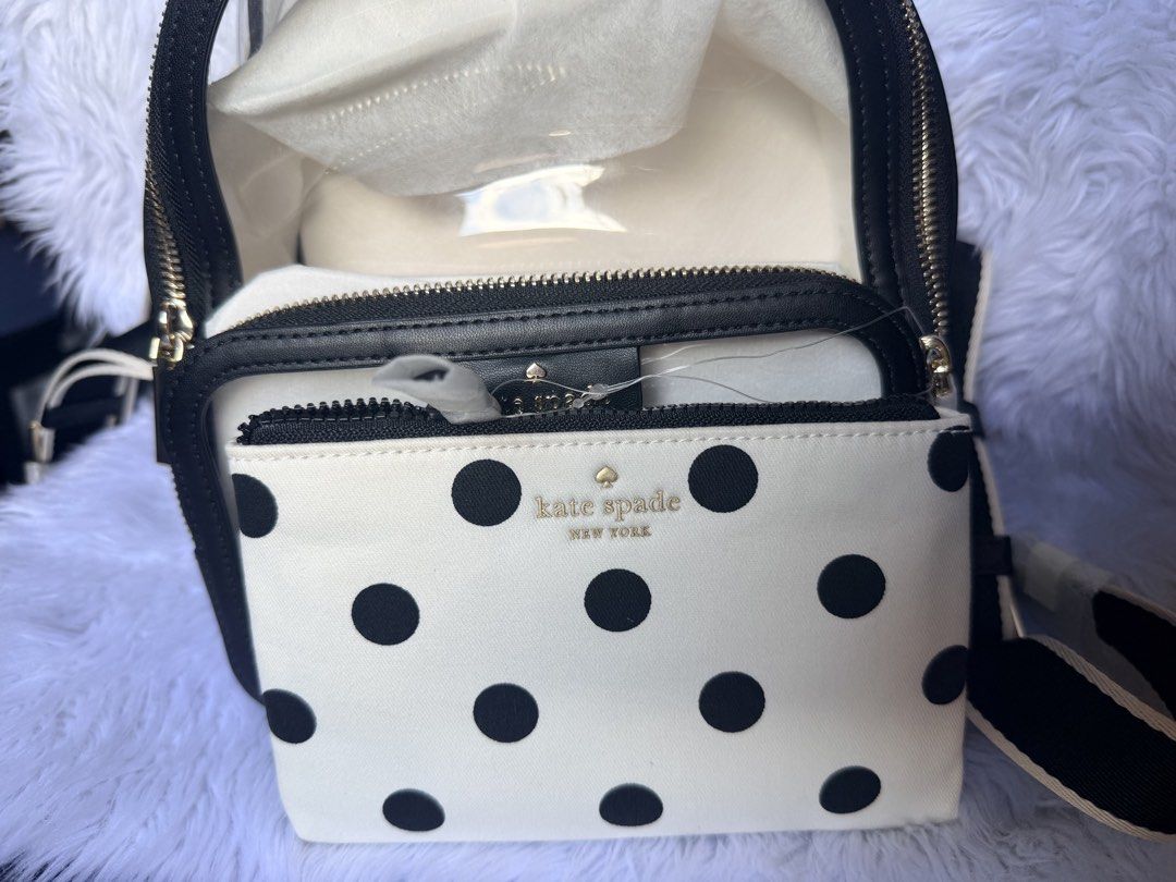 Kate Spade Claire See-Through Raining Dot Print Medium Backpack (Category: Backpacks) located in Rizal. Submitted by gannda (Listing ID 1469241491, Image 2). Description: - Brand: Kate Spade - Style: Claire See-Through Raining Dot Print Medium Backpack - Color: sBlack and White - Condition: Brand new with original tags attached and protective wrapping on hardware/handles - Material: Clear vinyl body with polka dot front pouch - Features: Adjustab