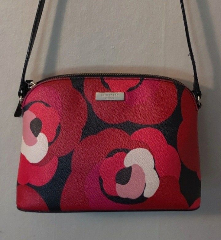 Kate Spade Printed Mini Dome Shoulder / Crossbody Bag (Category: Luxury Bags & Wallets) located in Navotas City. Submitted by ms.soulana (Listing ID 1469202189, Image 1). Description: PreOwmed Lightly Used Kate Spade Printed Mini dome Shoulder /Crossbody bag Small MultiColor in Red ,Pink ,black - Style: Dome Crossbody Bag - Design: Bold red, pink, and black floral print with smooth black leather trim - Hardware: Premium gold-tone - Closure: Secur