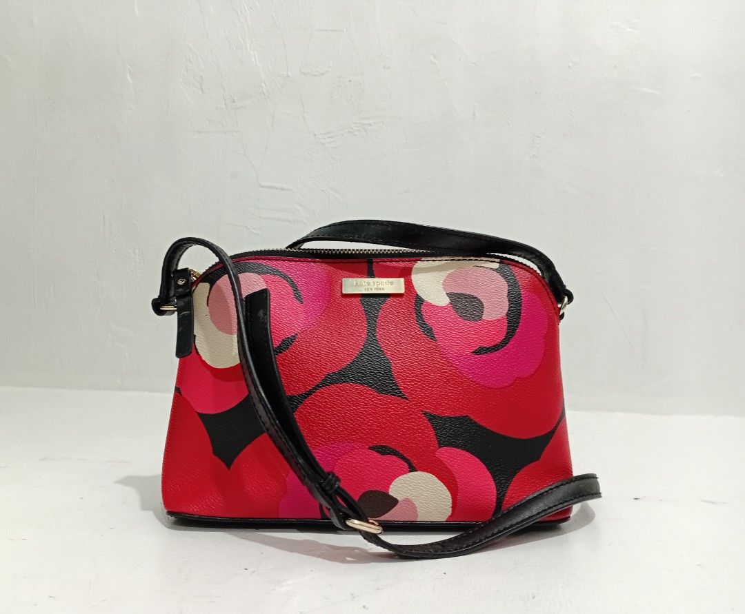 Kate Spade Printed Mini Dome Shoulder / Crossbody Bag (Category: Luxury Bags & Wallets) located in Navotas City. Submitted by ms.soulana (Listing ID 1469202189, Image 2). Description: PreOwmed Lightly Used Kate Spade Printed Mini dome Shoulder /Crossbody bag Small MultiColor in Red ,Pink ,black - Style: Dome Crossbody Bag - Design: Bold red, pink, and black floral print with smooth black leather trim - Hardware: Premium gold-tone - Closure: Secur