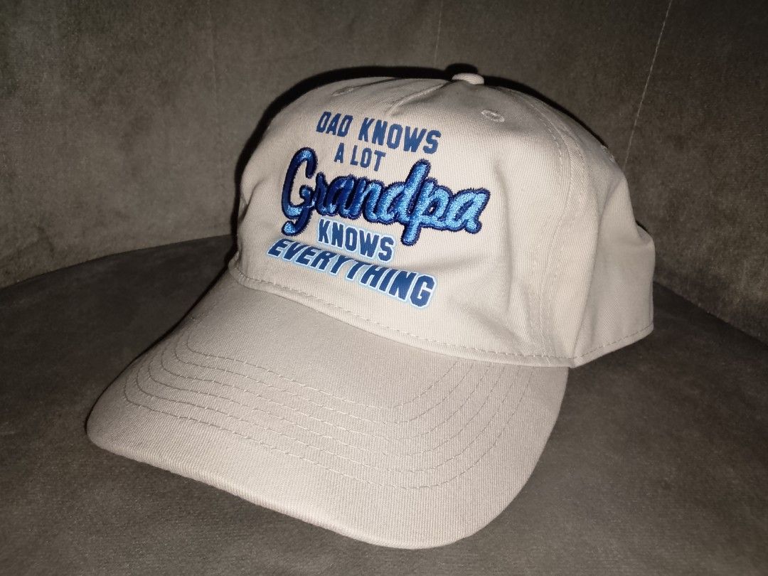 Khaki Grandpa Knows Everything Embroidered Baseball Cap (Category: Caps & Hats) located in Binangonan. Submitted by yuristalin888 (Listing ID 1469357291, Image 2). Description: A stylish khaki baseball cap featuring bold blue embroidered “Dad Knows a Lot, Grandpa Knows Everything” lettering. Designed with a curved brim, stitched panels, and an adjustable back strap for a comfortable fit. A fun and thoughtful gift for grandfathers, perfect for eve
