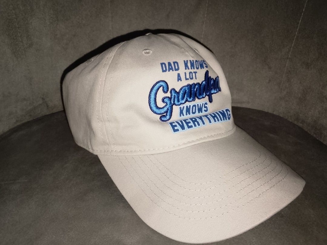 Khaki Grandpa Knows Everything Embroidered Baseball Cap (Category: Caps & Hats) located in Binangonan. Submitted by yuristalin888 (Listing ID 1469357291, Image 3). Description: A stylish khaki baseball cap featuring bold blue embroidered “Dad Knows a Lot, Grandpa Knows Everything” lettering. Designed with a curved brim, stitched panels, and an adjustable back strap for a comfortable fit. A fun and thoughtful gift for grandfathers, perfect for eve