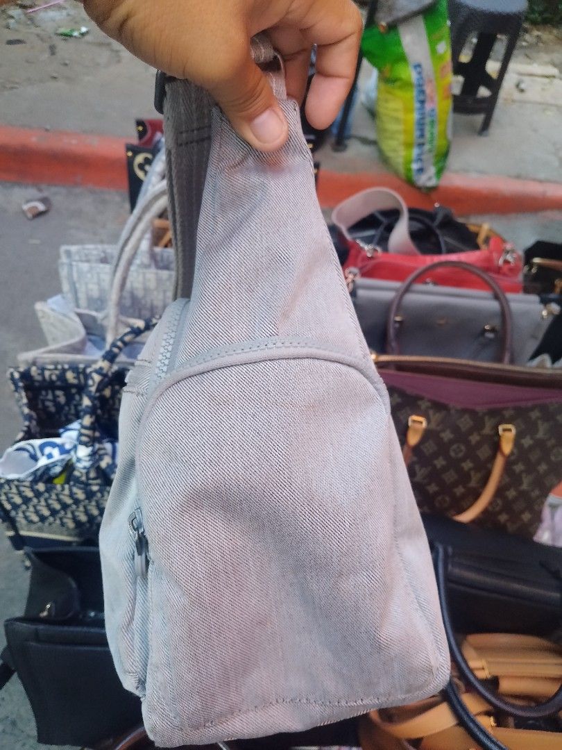 Kipling Grey Shoulder Bag Crossbody (Category: Cross-body Bags) located in Manila. Submitted by fiercedog.23d517 (Listing ID 1469163220, Image 3). Description: - Authentic Kipling shoulder bag in a stylish grey denim-look fabric - Multiple exterior zipped pockets for organized and easy storage - Secure zip top closure to keep your essentials safe - Comfortable adjustable strap for everyday wear - Interior lined with signature patterned fabric and
