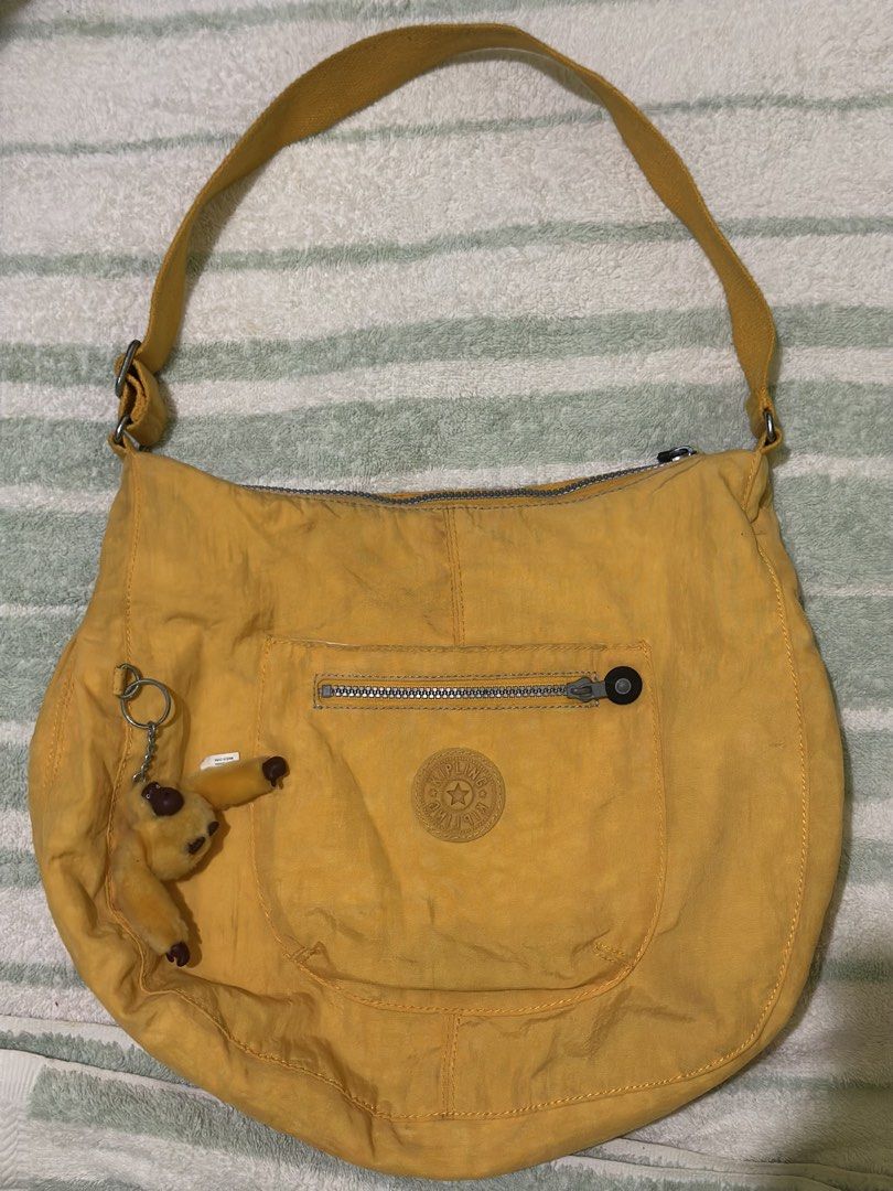Kipling Nylon Tote Bag in Yellow (Category: Tote Bags) located in Pagsanjan. Submitted by leyuxdenini (Listing ID 1469327479, Image 1). Description: Good conditon.