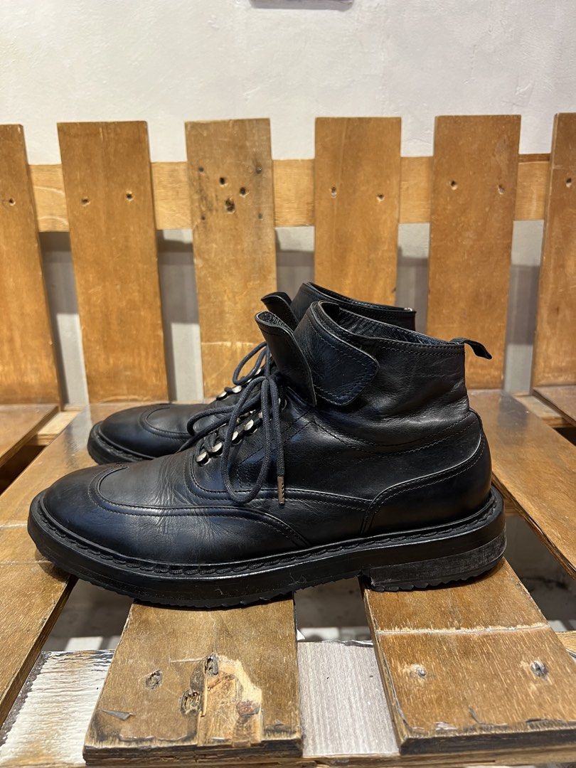 Kris Van Assche black leather wingtip lace-up boots (Category: Boots) located in Quezon City. Submitted by shanks. (Listing ID 1469186740, Image 2). Description: Kris Van Assche black leather wingtip lace-up boots featuring a prominent ankle strap detail. Size : 43 Sign of wear in good condition Issue : missing heel pull tab , rust , sole sep. .