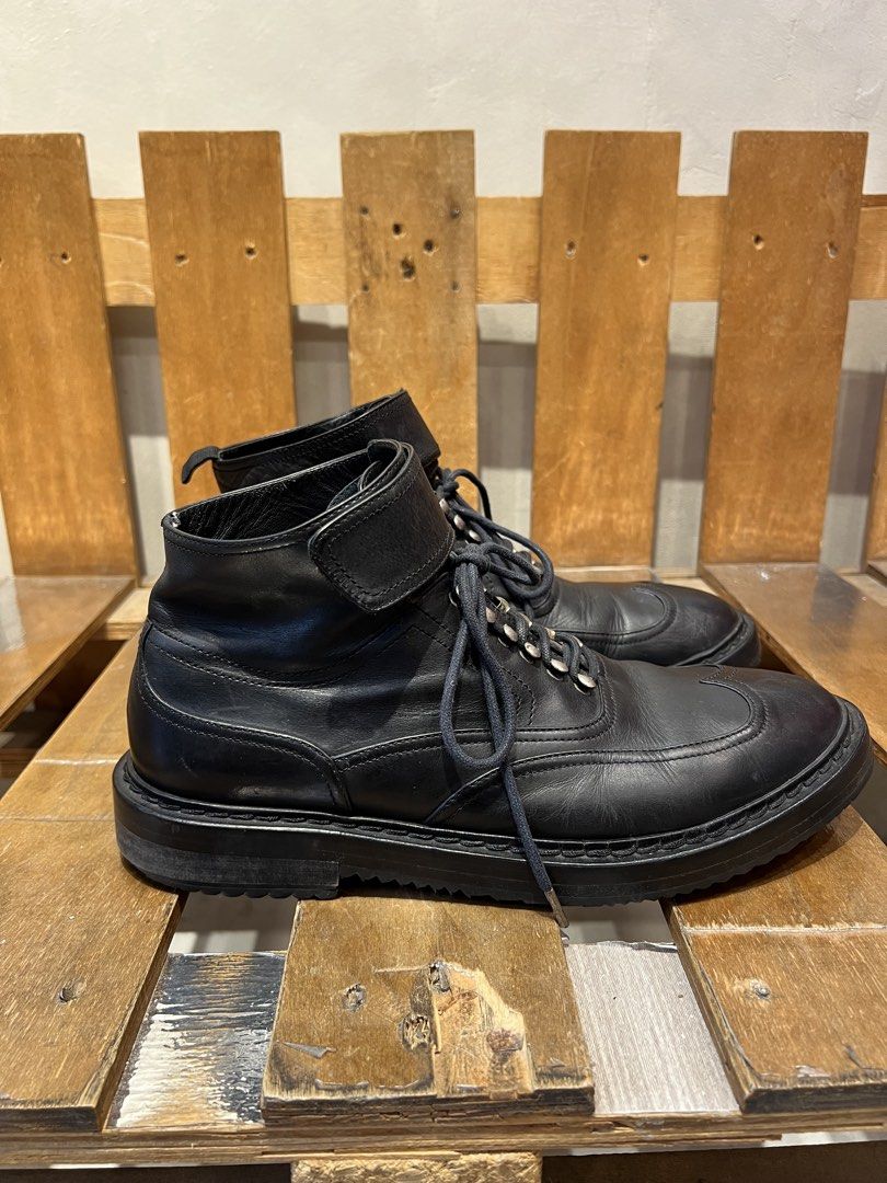 Kris Van Assche black leather wingtip lace-up boots (Category: Boots) located in Quezon City. Submitted by shanks. (Listing ID 1469186740, Image 3). Description: Kris Van Assche black leather wingtip lace-up boots featuring a prominent ankle strap detail. Size : 43 Sign of wear in good condition Issue : missing heel pull tab , rust , sole sep. .