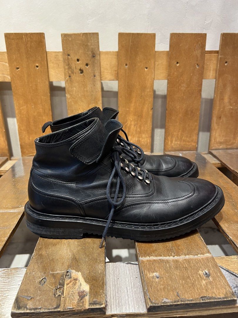 Kris Van Assche black leather wingtip lace-up boots (Category: Boots) located in Quezon City. Submitted by shanks. (Listing ID 1469186740, Image 1). Description: Kris Van Assche black leather wingtip lace-up boots featuring a prominent ankle strap detail. Size : 43 Sign of wear in good condition Issue : missing heel pull tab , rust , sole sep. .