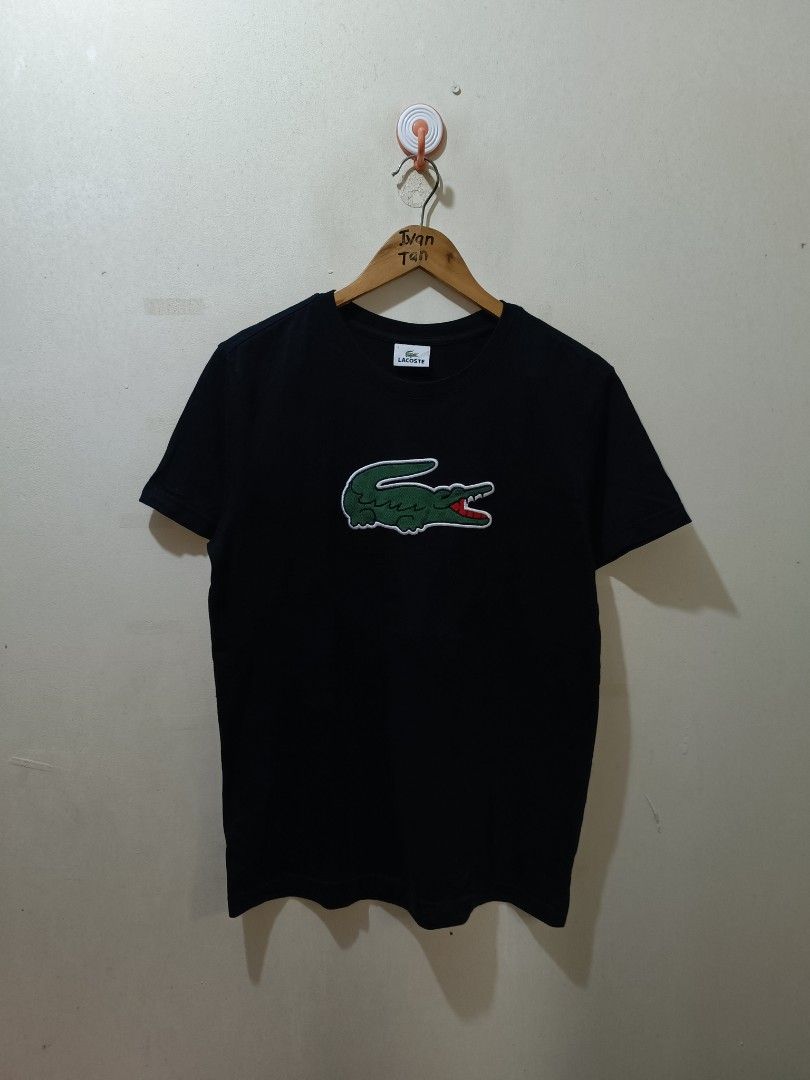 Lacoste Big Logo Shirt (Category: Tshirts & Polo Shirts ) located in Makati City. Submitted by ivsseyow03 (Listing ID 1469278946, Image 1). Description: Black short-sleeve t-shirt from Lacoste. Features a huge embroidered green crocodile logo patch right on the chest. Classic crew neck style. Size 3 (95) on the inner collar tag. 100% cotton fabric, soft feel. Interior care tags intact with model number TH6708-92. Clean fabric, no stains or damage