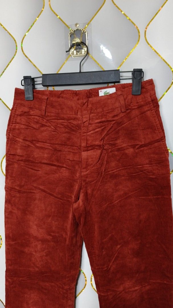 Lacoste Corduroy Pants Rust Red (Category: Jeans) located in Manila. Submitted by zariyah.1986 (Listing ID 1469216584, Image 2). Description: - Brand: Lacoste - Style: Classic straight cut corduroy pants - Color: Rich rust red - Size: Marked 38 (tagged 26 x 36 inside) - Details: Soft ribbed texture, belt loops, standard pockets, and signature crocodile logo tag - Condition: Great vintage aesthetic with solid construction.