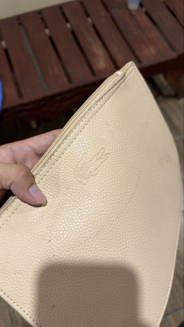 LACOSTE CREAM POUCH (Category: Purses & Pouches) located in Manila. Submitted by urban.vintage (Listing ID 1469309784, Image 3). Description: ISSUE: NONE (NEED WASH) MOP :GCASH (NO COD) SHIP VIA: LALAMOVE & J&T LOCATION: PASIG CITY.