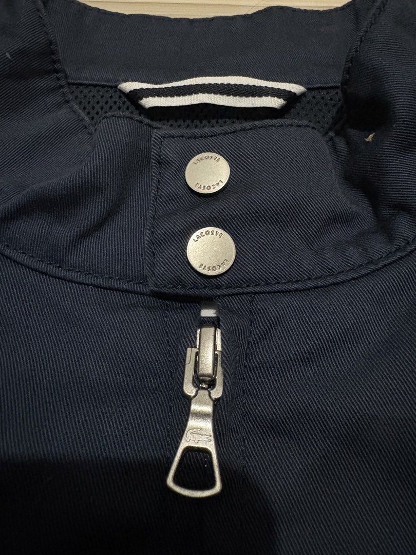 Lacoste Harrington Jacket Navy Blue Size US S FR 48 (Category: Coats, Jackets and Outerwear) located in Ajuy. Submitted by reeyn0515 (Listing ID 1469325546, Image 3). Description: - Brand: Lacoste (Authentic) - Style: Harrington Jacket - Color: Dark Navy Blue - Size: US Small / FR 48 - Measurements: 21.5" across the chest, 25" in length - Details: Mock neck with dual snap button closure, iconic embroidered crocodile logo, branded full zip hardwar