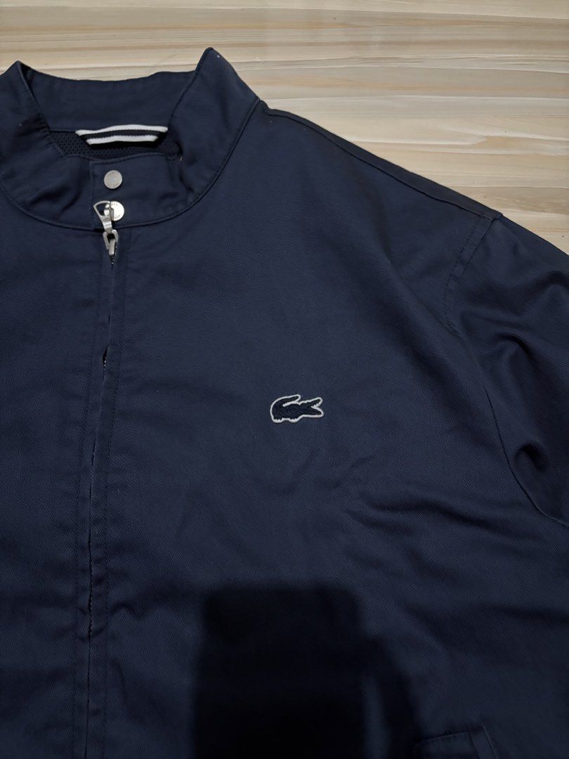 Lacoste Harrington Jacket Navy Blue Size US S FR 48 (Category: Coats, Jackets and Outerwear) located in Ajuy. Submitted by reeyn0515 (Listing ID 1469325546, Image 2). Description: - Brand: Lacoste (Authentic) - Style: Harrington Jacket - Color: Dark Navy Blue - Size: US Small / FR 48 - Measurements: 21.5" across the chest, 25" in length - Details: Mock neck with dual snap button closure, iconic embroidered crocodile logo, branded full zip hardwar