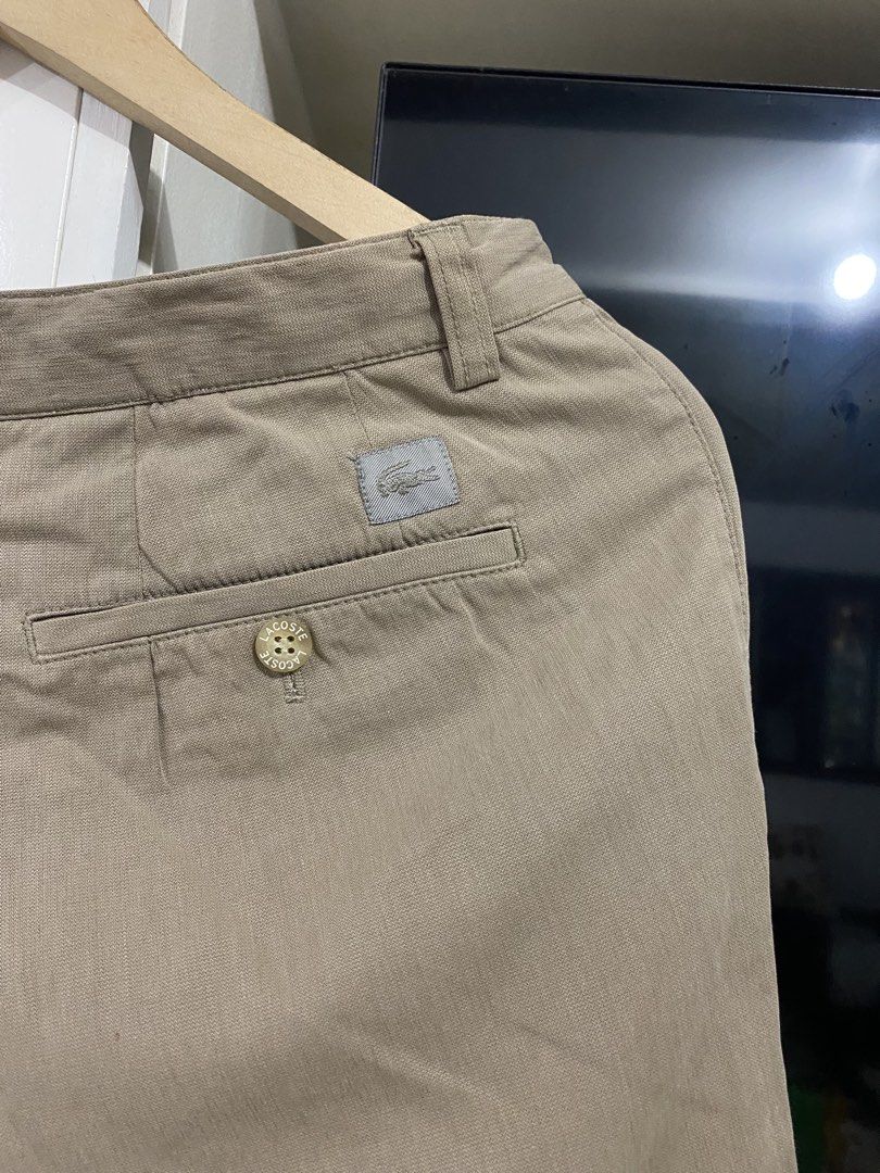 Lacoste Khaki Chino Pants 30x40 (Category: Chinos) located in Santa Maria. Submitted by jordangail (Listing ID 1469251250, Image 3). Description: - Brand: Lacoste - Style: Khaki pleated chinos / classic casual trousers - Size: 30x40 - Material: Comfortable cotton and polyurethane blend - Details: Double button back pockets with embroidered logo patch - Versatility: Neutral earth tone color goes with everything 30x40 Hem 9.3 Mine na Jnt God bless.
