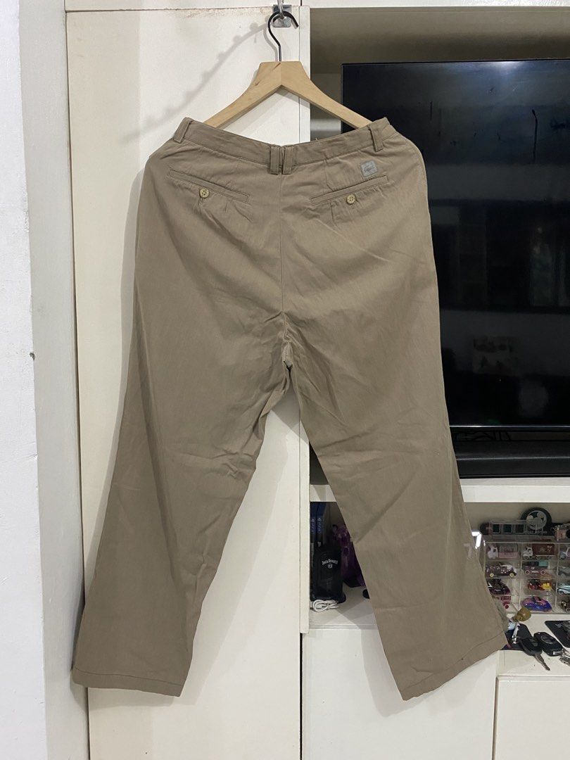 Lacoste Khaki Chino Pants 30x40 (Category: Chinos) located in Santa Maria. Submitted by jordangail (Listing ID 1469251250, Image 2). Description: - Brand: Lacoste - Style: Khaki pleated chinos / classic casual trousers - Size: 30x40 - Material: Comfortable cotton and polyurethane blend - Details: Double button back pockets with embroidered logo patch - Versatility: Neutral earth tone color goes with everything 30x40 Hem 9.3 Mine na Jnt God bless.