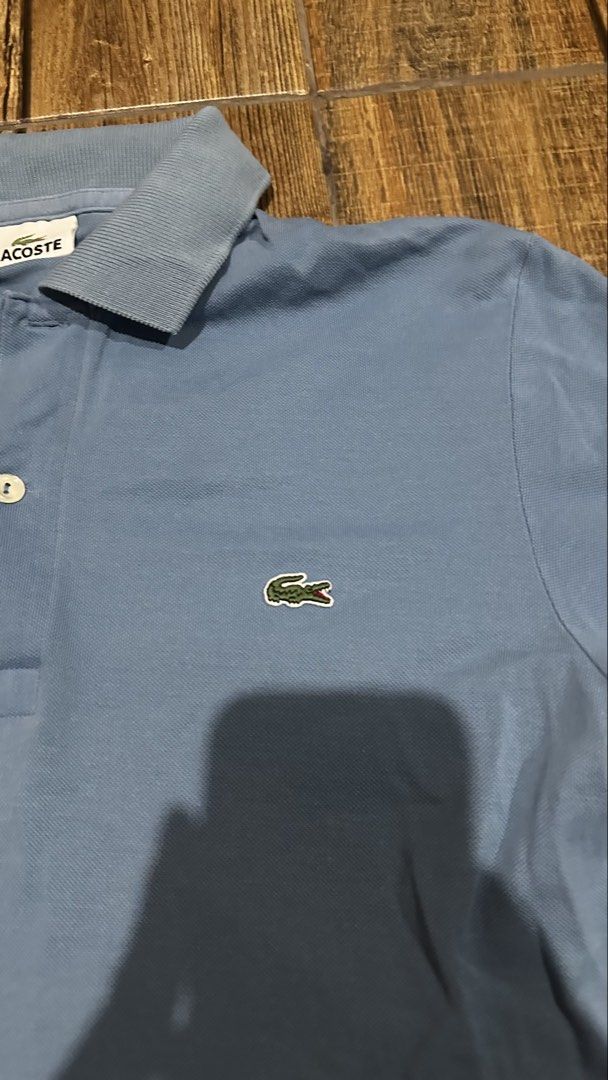 LACOSTE LIGHT BLUE (Category: Tshirts & Polo Shirts ) located in Manila. Submitted by urban.vintage (Listing ID 1469200506, Image 2). Description: ISSUE: NONE (NEED WASH) MOP :GCASH (NO COD) SHIP VIA: LALAMOVE & J&T LOCATION: PASIG CITY LENGTH: 26 WIDTH : 19.