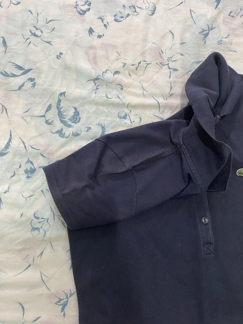 Lacoste Navy Blue Polo Dress (Category: Dresses) located in Lucena. Submitted by selenaandco (Listing ID 1469201743, Image 3). Description: - Brand: Lacoste - Color: Dark Blue - Material: Comfortable cotton pique fabric - Design: Classic polo collar with front button placket - Details: Short sleeves with ribbed cuffs and signature embroidered green crocodile logo on the chest - Style: Clean, classic, and sporty - ideal for casual outings or tenni