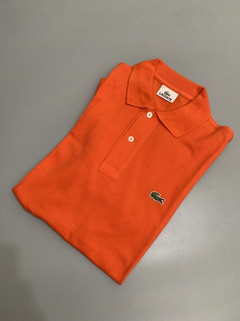 Lacoste Orange Polo Shirt (Category: Tshirts & Polo Shirts ) located in Mexico. Submitted by bugskiethrift (Listing ID 1469252876, Image 1). Description: size: 2 19x26 good as new condition bump a message for more info.