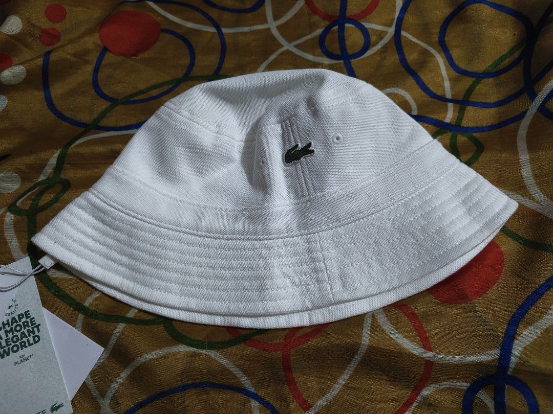 Lacoste Unisex bucket hat Large (Category: Hats & Beanies) located in Paranaque City. Submitted by fabbieb (Listing ID 1469173072, Image 3). Description: Lacoste Bucket Hat White Large New with tags No paper bag 💯authentic merchandise ❗NO when worn photo-- white item, iwas mantsa... hair oil. thanks for understanding. ❗first photo(collage) from brand's site. Ctto. Used for reference only. P2500 plus SF Location: Parañaque City ➡️ NO RUSH SHIPPIN