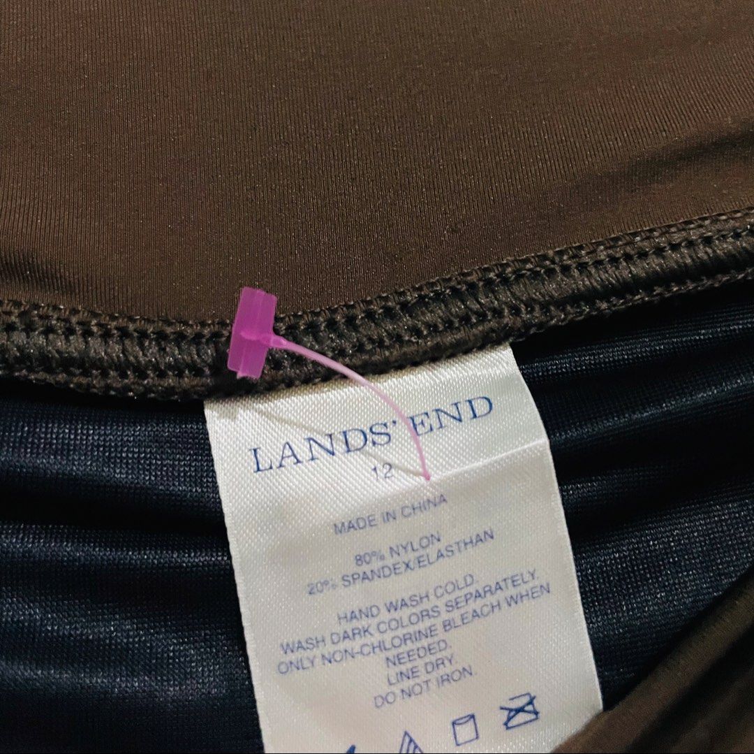 Lands' End Brown Skort (Category: Skirts) located in Caloocan City. Submitted by lovemyclothes21 (Listing ID 1469266336, Image 3). Description: - Brand/Model: Lands' End - Size: 12 - Color: Solid brown - Coverage: Built-in swim bottoms underneath for a secure fit - Design: Flattering high waistband - Material: 80% nylon, 20% spandex/elasthan - Care Instructions: Hand wash cold - Ideal for: Beach trips, pool days, and water sports.