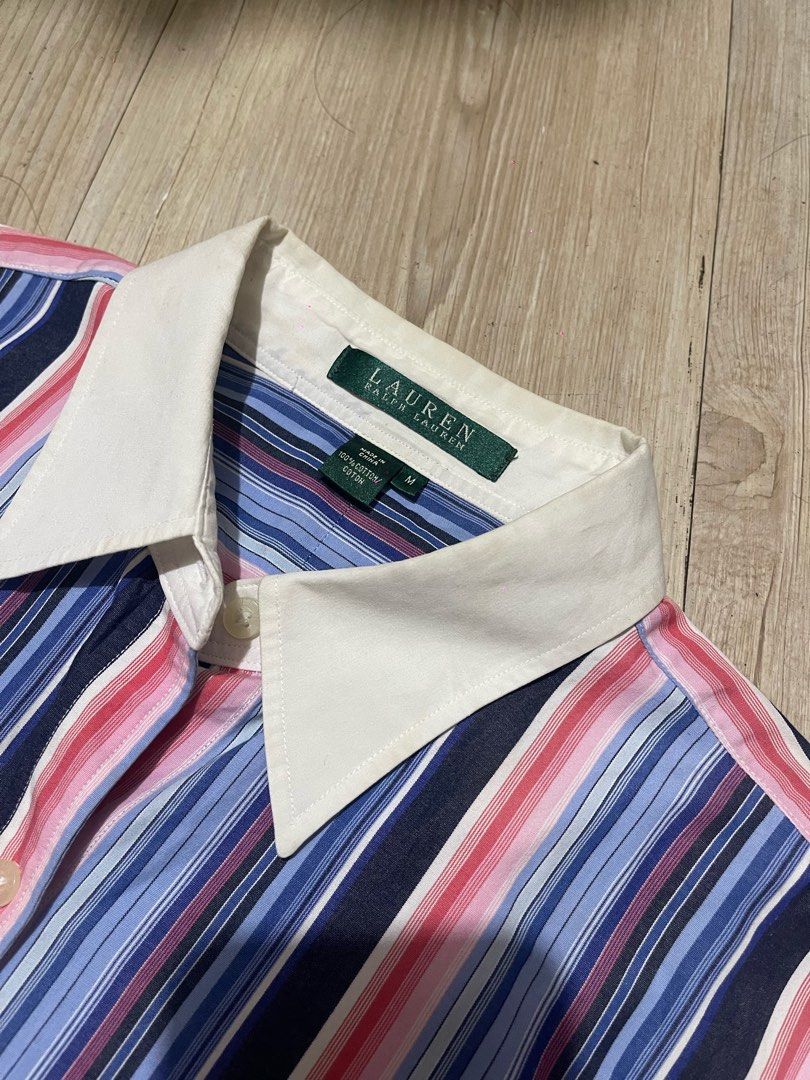 Lauren Ralph Lauren Striped Button-Down Shirt (Category: Tshirts & Polo Shirts ) located in Baguio. Submitted by find_found001 (Listing ID 1469338580, Image 2). Description: - Brand: Lauren Ralph Lauren - Style: Striped button-down shirt with contrast white collar and cuffs - Color: Multi-color vertical stripes (blue, pink, navy) with white accents - Size: M - Material: 100% Cotton (machine washable) - Special Feature: Embroidered RL monogram log