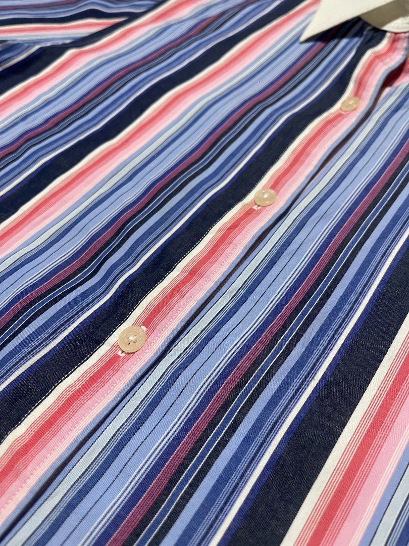 Lauren Ralph Lauren Striped Button-Down Shirt (Category: Tshirts & Polo Shirts ) located in Baguio. Submitted by find_found001 (Listing ID 1469338580, Image 3). Description: - Brand: Lauren Ralph Lauren - Style: Striped button-down shirt with contrast white collar and cuffs - Color: Multi-color vertical stripes (blue, pink, navy) with white accents - Size: M - Material: 100% Cotton (machine washable) - Special Feature: Embroidered RL monogram log