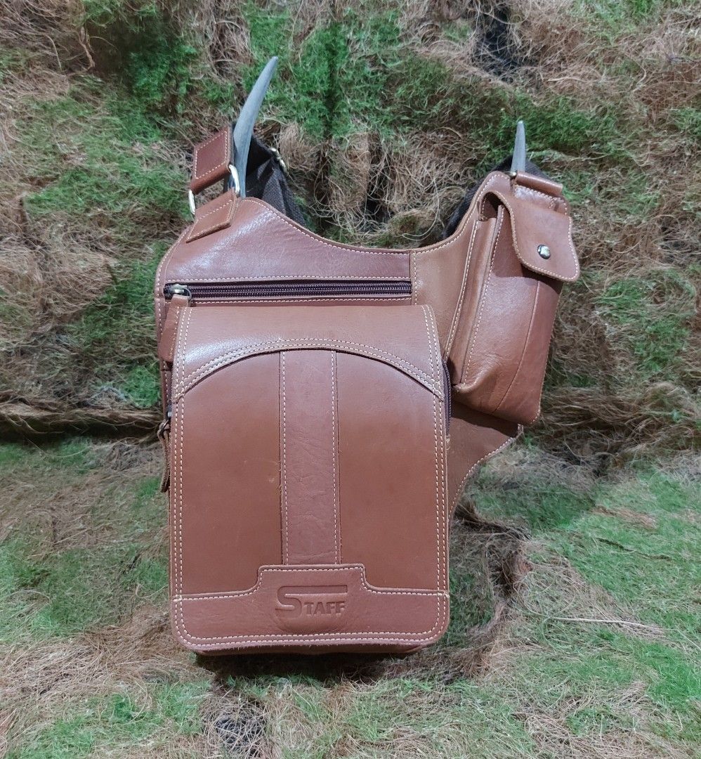 Leather slingbag (Category: Sling Bags) located in Baguio. Submitted by swiftdragon.1466ef (Listing ID 1469295119, Image 1). Description: thrifted bag. staff brand cowhide leather slingbag for men euc.. L-12", H-12.5", W-2.5"... j&t courier payment first plus sf, baguio city location .