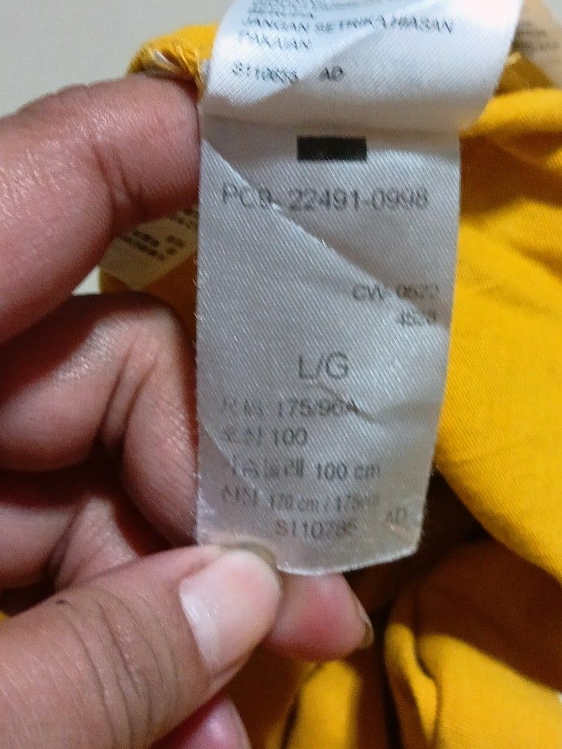 Lebays Yellow T-Shirt (Category: Tshirts & Polo Shirts ) located in Valenzuela. Submitted by AnahThrift (Listing ID 1469333393, Image 3). Description: - Brand: Lebays - Color: Bright yellow - Size: L (Measures 21" pit to pit by 28" length) - Design: Small logo on front, large woodgrain box logo graphic on the back - Details: Crew neck, short sleeves, made in Turkey - Condition: Clean fabric with tag attached near the collar.