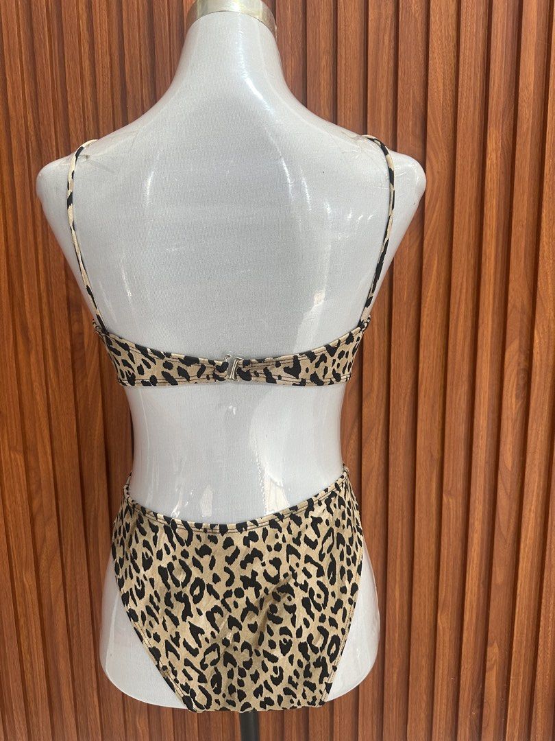 Leopard Print Cutout One-Piece Swimsuit (Category: Bikinis & Swimsuits) located in Manila. Submitted by cherish_24 (Listing ID 1469221553, Image 3). Description: - used once only Trendy leopard print one-piece swimsuit - Chic cutout details at the front and sides - Crossover chest straps meeting at a center metal ring - Flattering high-cut leg style - Secure back clasp closure - Soft and stretchy fabric for all-day comfort - Perfect for beach tri