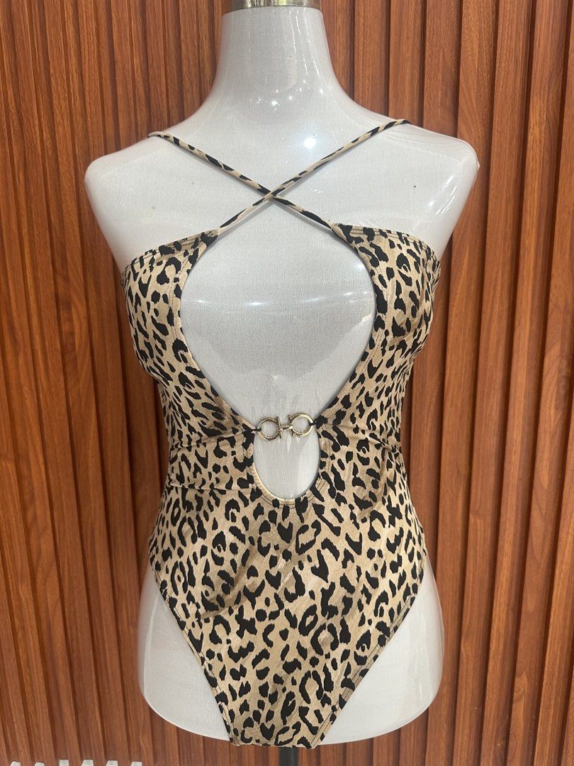 Leopard Print Cutout One-Piece Swimsuit (Category: Bikinis & Swimsuits) located in Manila. Submitted by cherish_24 (Listing ID 1469221553, Image 1). Description: - used once only Trendy leopard print one-piece swimsuit - Chic cutout details at the front and sides - Crossover chest straps meeting at a center metal ring - Flattering high-cut leg style - Secure back clasp closure - Soft and stretchy fabric for all-day comfort - Perfect for beach tri